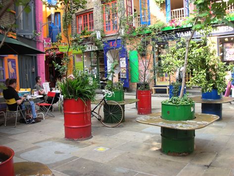 barrel garden Recycled Planters, Neal's Yard, Colorful Buildings, Neals Yard, Neals Yard Remedies, Oil Barrel, Barrel Planter, Oil Drum, Recycled Garden