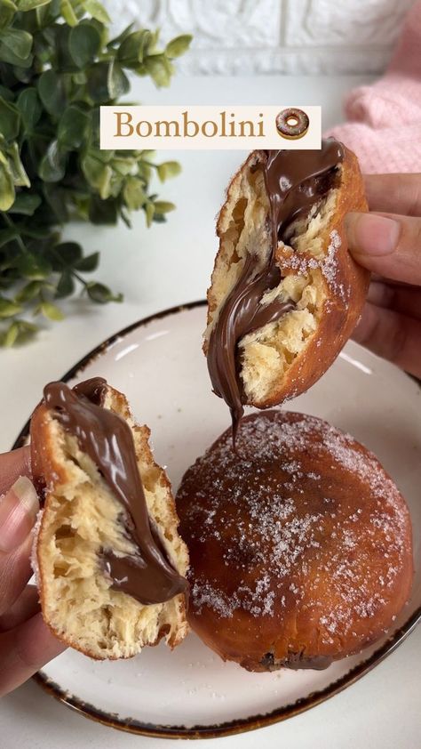 143K views · 6.6K reactions | ✨ Bombolini (Italian Nutella Stuffed 🍩)✨ Holy Bombolini, quite literally! Are you looking at that Nutella pull, that’s all you need for the inner sweet tooth to start craving these bite of choclate heaven! 🫶🏻🍩 Crumbly and soft bun on the outside, fudgy and sweet on the insides- you can’t enjoy this without making a mess but it’s totally worth it! 🤎🤤 Recipe: Makes: around 10-12 1. Sprinkle 1.5 tsp dry yeast and one teaspoon of sugar over 1/2 cup warm milk, give it a gentle stir and set aside until it’s foamy. 2. Add 2 cups all purpose flour , 1/2 cup castor sugar, 1 tsp salt, along with 3 tbsp softened butter and 1 egg and the foamy yeast mixture knead for about 5 minutes or until your dough comes together & is smooth. Avoid using extra flour as much All Purpose Flour, Warm Milk, One Teaspoon, Dry Yeast, 1 Egg, 2 Cups, Purpose Flour, Yeast, Nutella