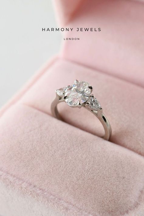 Take a look at this beautiful Oval Trilogy engagement ring. Thi is a 1ct Oval E VS2 centre diamond with 0.40ct Pear shape side stones. Oval Trilogy Engagement Ring, Trilogy Engagement Ring, Engagement Ring Platinum, Oval Engagement Ring, Bespoke Engagement Ring, Oval Engagement, Engagement Rings Platinum, Engagement Rings Oval, Oval Diamond