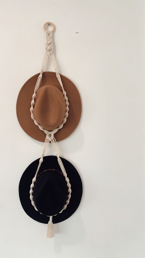 Stop stashing your hats in the cupboard where they gather dust and lose their form; instead, showcase them using this stylish macrame hat hanger! We all know that the best hat to protect us from the sun on an outdoor adventure is a quality wide brim hat. But let’s face it, they are hard to store whilst not in use. This double macrame hat hanger will not only protect your wide brim hat's whilst in storage, they will add a touch of Bohemian décor to your home, caravan or holiday house. These beautiful pieces are handmade, using recycled cotton and made at the foot of the Blue Mountains. Hanging your beach & other hats has never been so easy, and aesthetically pleasing we might say. Materials: recycled beige/natural macrame cotton cord and a wooden ring. Drop measurements Double : 120cm *Thes Double Macrame Hat Hanger, Hat Hanger Macrame, Macrame Ball Cap Holder, Macrame Hat Hanger Pattern, Macrame Hat Hanger Diy, Macrame Hat Holder, Hat Holders, Macrame Hat Hanger, Hat Hangers