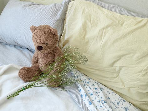 soft blue and yellow pastel floral aesthetic bed with a brown teddy bear stuffed animal, dried flowers, coquette korean minimalist farmhouse floral old-fashioned bedroom style room inspo (my photo) Stuffed Bear With Flowers, Beige Yellow Aesthetic, Soft Yellow Aesthetic Vintage, Aesthetic Widgetsmith Pictures, Pastel Floral Aesthetic, Widgetsmith Pictures, Korean Minimalist Aesthetic, Blue And Yellow Pastel, Cute Wallpapers Blue