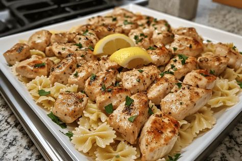 Savor Lemon Garlic Chicken Bites with Creamy Bowtie Pasta—a delicious, easy recipe perfect for family dinners. Ready in just 30 minutes! Lemon Garlic Chicken With Bowtie Pasta, Lemon Garlic Chicken Bites With Creamy Bowtie Pasta, Lemon Chicken Bowtie Pasta, Lemon Garlic Chicken With Bow Tie Pasta, Lemon Garlic Chicken With Creamy Bowtie Pasta, Chicken And Bowtie Pasta Recipes, Creamy Bowtie Pasta, Lemon Garlic Chicken Pasta, Creamy Lemon Chicken Pasta