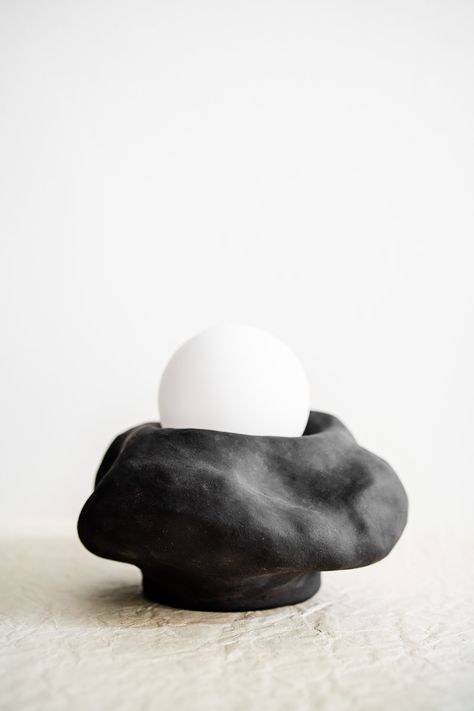 Black Cloud Lamp, takes your beautiful nights to the next level. *This unique ceramic lamp is made from high quality black stoneware clay using hand building techniques only. Fired at high temperature (1240oC) *Will add value to your home with its organic texture and minimalist shape. *Ready to Use: Cloth cable, wall plug and frosted globe included.  All you need to do to use this lamp is to plug it in and enjoy the coziness that the light spreads around.  *Wall plug: UK/EU/AUS/USA plug accordin Black Ceramic Lamp, Ceramic Wall Lamp, Handmade Ceramic Lamp, Ceramic Lamps Handmade, Ceramics Lamp, Wall Ceramics, Ceramic Candles, Clay Lamp, Sculptural Lamp