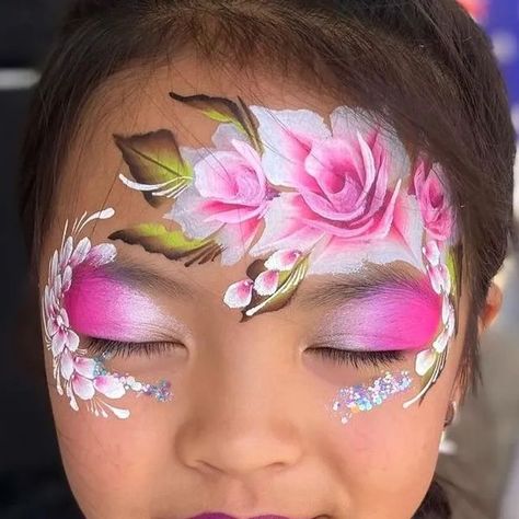 The Face Paint Shop on Instagram: "I mean, this is stunning. It could be for a wedding! Amazing.  Posted @withregram • @emmiesfacepainting Scorching last day face painting for @fairdinkumcaravans  Thanks everyone who braved the heat. ☀️  #newcastleshowground #newcastle #newy #whatsonnewcastle #summer #australia #australiansummer #facepaintau #facepaintaustralia #bodypaint #bodyart #bodypainter #facepainter #facepainting #facepaint #mua #rosefacepaint #rose #roses #princess #princesscrown #onestroke #butterfly #rainbow #mermaid #elsa #facepaintcrown #tiger #skull #facepaintskull" Face Painting Stall Ideas, Cherry Blossom Face Paint, Onestroke Butterfly, Rose Face Paint, Flowers Face Paint, Flowers Face Painting, Princess Face Paint, Flower Face Paint, Face Paint Party