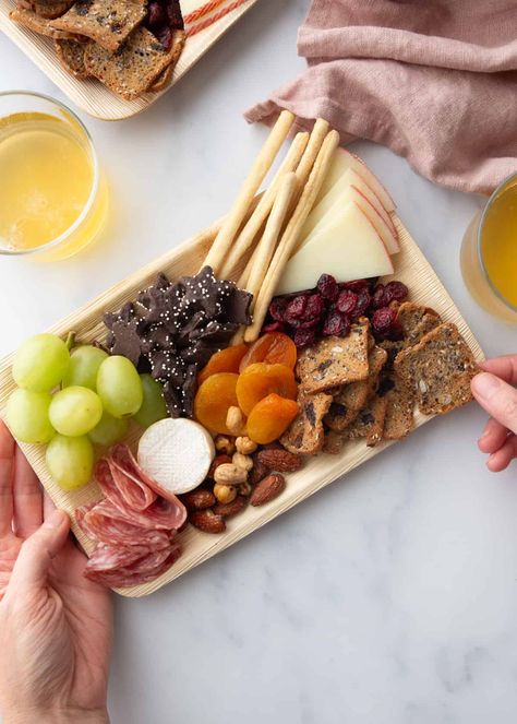 Charcuterie boards are a fun addition to any gathering, but sometimes mini charcuterie boards make more sense than a larger display. Small charcuterie boards are great for events where you want everyone to grab something quickly and mingle, for a movie night where you want everyone to get an even mix of the foods, or for an event where you just want to portion everything out ahead of time. #charcuterie #snacks #entertaining #easyrecipe #mini Charcuterie Board Breakfast, Butter Board Charcuterie, Butter Board Ideas, Butter Board Recipe, Board Snacks, Mini Charcuterie Boards, Charcuterie Snacks, Snacks Board, Small Charcuterie Board