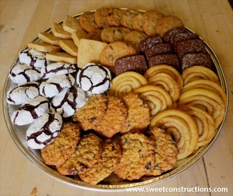 Assorted comfort food cookie platter - oatmeal raisin, chocolate crackles, vanilla shortbread squares, pecan chocolate chip, dark chocolate shortbread squares, and snickerdoodle swirls Biscuit Presentation Ideas, Biscuit Platter Ideas, Cookies Platter, Cookies Display Ideas Trays, Cookie Platters Display Wedding, Cookie Platters Display Ideas, How To Display Cookies On A Platter, Cookie Platters, Cookie Platter