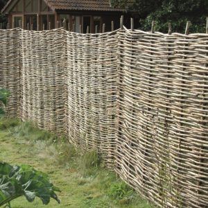 Wattle hurdles are made from woven hazel rods. They make an attractive rustic fence which is ideal for protecting a newly planted hedge providing a screen until the plants are established. Castle Coombe, Natural Fencing, Wattle Fence, Garden Dividers, Wooden Fence Panels, Garden Fences, Rustic Fence, Garden Privacy, Garden Screening