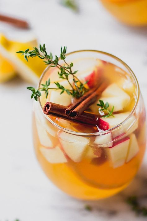 Make this super easy fall sangria for your next party or Thanksgiving get-together; made with prosecco, it's sparkling and full of comfort with cinnamon and thyme. Add in bourbon for a warm, deep flavor. | Fork in the Kitchen #recipe #cocktail #sangria #thanksgiving Sangria With Prosecco, Apple Pie Sangria, Apple Sangria Recipes, Thanksgiving Sangria, Apple Cider Sangria Recipe, Fall Sangria Recipes, Caramel Apple Sangria, White Wine Sangria Recipe, Easy Sangria Recipes