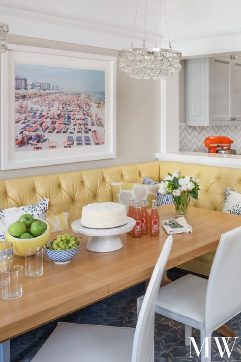 A yellow tufted banquette is the star in this breakfast nook designed by Los Angeles "Designer to Watch" Massucco Warner. As seen in House Beautiful, featuring a beachy Slim Aarons photo. Yellow Kitchen Accents, Kitchen Booths, Cafe Seating, Small Kitchen Tables, House Of Turquoise, All White Kitchen, Kitchen And Dining Room, Banquette Seating, Kitchen Nook