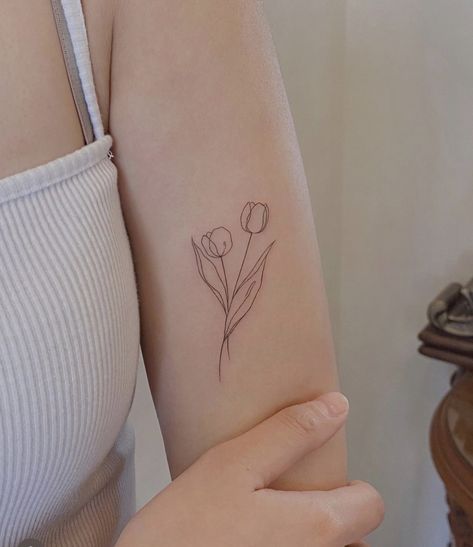 Tulips Tattoos For Women, Delicate Tulip Tattoo, Double Tulip Tattoo, Tulip Tattoo Minimalist, Fineline Tulip Tattoo, Tulip And Butterfly Tattoo, Tulip Line Tattoo, Tulip Fine Line Tattoo, Minimalist Tulip Tattoo