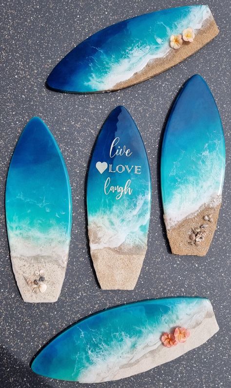 **Epoxy resin artwork - Coastal wall decoration on 12 inch Surfboard** Perfect for beach lovers and coastal home decor enthusiasts, this handmade artwork captures the essence of a beautiful beach scene  and delivers a sweet message. Poured with two layers of high-quality colored resin and realistic 3D waves that wash upon a small beach of natural sand. Each artwork is handmade, making it a one-of-a-kind addition to your decor. An eye-catcher for living rooms, bedrooms, bathrooms or any space tha Surfboard Resin Art, Ocean Pour Resin, Beach Theme Resin Art, Ocean Beach Resin Art, Surfboard Resin, Beautiful Beach Scenes, Ocean Wave Resin Art, Resin Wall Art, Resin Artwork