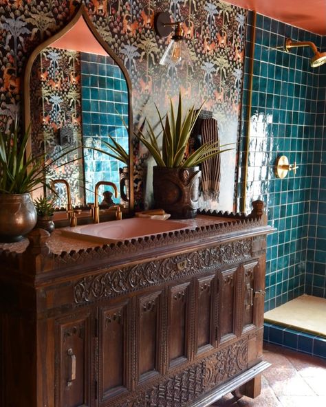 Here’s a little bathroom remodel inspo - complete with a before photo that’s pretty incredible to remember. We used one of our antique Indian dowry chests, called a Majuce, as the sink vanity, amazing Tigris wallpaper by @thejungalow which makes the room really, gorgeous @handcraftedtile Heritage Saltillo on the floor and peacock zellij for the shower, and we hung extra large tesbih beads from Istanbul as a WC curtain. It’s wild and wonderful and I love it so! We are getting ready to embark u... Indian Bathroom, Little Bathroom, Small Bedroom Interior, Jungalow Style, Indian Interiors, Flower Scent, Powder Rooms, Sink Vanity, Dream Bathrooms