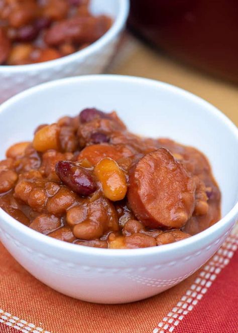 These Kielbasa Baked Beans make for a hearty and flavorful summer side dish or spoon them over rice for an easy, satisfying meal. #bakedbeans #easybeans #kielbasabeans #kielbasa #summerrecipes #potluckrecipes Recipes With Kielbasa, Kilbasa Sausage Recipes, Baked Bean Recipe, Easy Slider Recipes, Bbq Beans, Corn Side Dish, Kielbasa Recipes, Summer Side Dish, Baked Bean Recipes