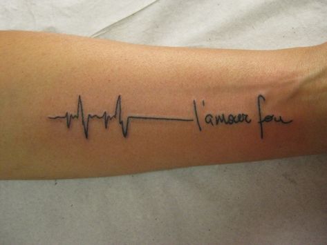 At the end of the line is a message in French, with the first word speaking of love. I couldn't make out the second word. If someone can identify it, leave it in the comments section. Micael Faccio via Flickr Almost all of us have seen someone we... Flatline Tattoo, Ekg Tattoo, Classy Tattoos For Women, 22 Tattoo, Scripture Tattoos, Places To Get Tattoos, Flower Wrist Tattoos, Retro Tattoos, Small Wrist Tattoos