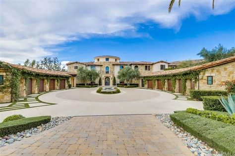 This Mediterranean-style Orange County, California home includes modern interior design and smart home features. The amenities of this luxe estate rival that of a resort, with an infinity-edge swimming pool and 110-foot waterslide, as well as a private wine tasting room alongside climate-controlled, walk-in wine storage. California Luxury, Wine Tasting Room, Luxury Portfolio, Smart House, Infinity Edge Pool, Home Automation System, Orange County California, Real Estate Property, Bedroom With Ensuite