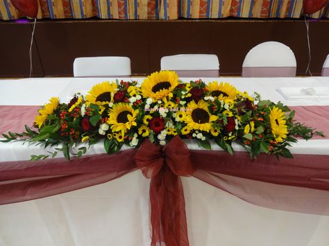 sunflowers with burgundy roses as a stunning combination Fall Wedding Sunflowers, Burgundy And Sunflower Wedding, Sunflowers And Red Roses, Red Sunflower Wedding, Red Roses And Sunflowers, Fall Sunflower Weddings, Sunflower Wedding Centerpieces, Wedding Sunflowers, Wedding Sweetheart Table Decor