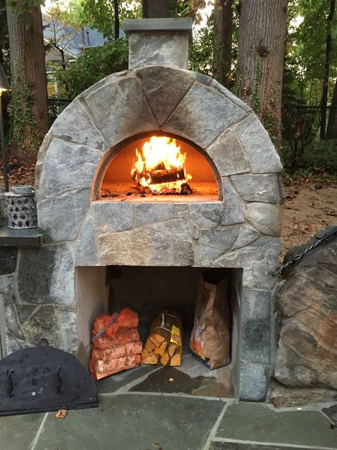 A wood-burning pizza oven is an amazing addition to any backyard space. The Amerigo Pizza oven has 1500 sq inches of cooking space and allows for the authentic taste of wood burning oven. #pizza #pizzaoven #fire #wood #outdoor #outdoorliving #masonry Home Made Wood Fire Pizza Oven, Stone Pizza Oven Outdoor, Diy Outdoor Pizza Oven, Wood Fired Pizza Oven Diy, Patio Redo, Outdoor Pizza Oven Kits, Outdoor Fireplace Pizza Oven, Pizza Oven Outdoor Diy, Backyard Pizza Oven