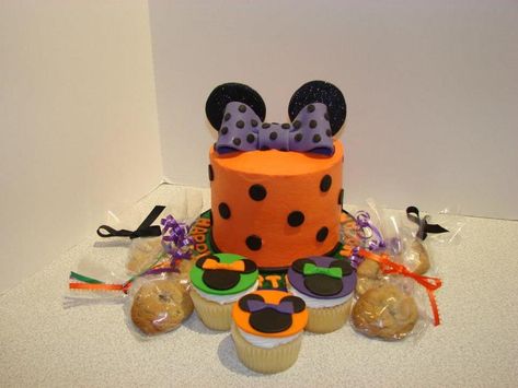 Minnie Mouse Theme In Halloween Colors Small buttercream covered cake with fondant gumnpaste bow, ears and dots. Cupcakes with fondant... Minnie Mouse Halloween Cake, Minnie Halloween Birthday Party, Minnie Halloween Cake, Minnie Mouse Halloween Birthday Party, Disney Halloween Cake, Disney Halloween Birthday Cake, Mickey Mouse Halloween Cake, Halloween Mickey Cake, Mickey And Minnie Halloween Party