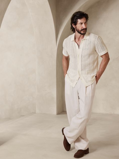 Lightweight and airy, this button-up polo is cut form the season's crochet-inspired cotton fabric, inviting you to layer over lighter pieces or wear on its own.  Resort collar with button-front closure.  Straight hem.  #837644 Standard fit.  Short sl Summer Men’s Suit, Mens Wedding Beach Outfit, Men Outfit For Beach Wedding, Men’s Party Wear, Bohemian Wedding Outfit Men, Night In Ibiza Outfits, Palm Springs Mens Outfits, Beach Party Men Outfit, Men Resort Outfit