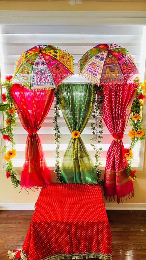 Perfect for festive season I did this decor for Janmastmi however you can use it for diwali, navratri and any other pooja. Please comment if you like it!! Teej Festival Stage Decoration, Umbrella Decorations For Ganpati, Decoration Ideas For Dandiya Night, Teej Festival Backdrop, Rath Yatra Decoration Idea, Teej Festival Decoration Ideas At Home, Teej Decorations Party, Decorating Ideas For Pooja At Home, Sawan Celebration Decorations