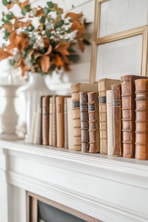 Mantle With Books, Fall Mantle Decor 2024, Lights On Mantle, Books On Mantle, Fall Mantle Decor Ideas, Fall Mantle Ideas, Bedroom Mantle, Moody Cottage, Autumn Mantle