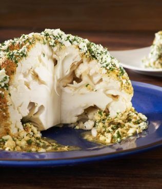 Whole Roasted Cauliflower With Feta And Greek Honey, Diana Kochilas Recipes, Whole Roasted Cauliflower With Feta, Roasted Cauliflower With Feta, Diane Kochilas, Greek Vegetables, Longevity Recipes, Roasted Cauliflower Recipes, Cauliflower Dishes