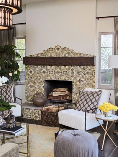 35 Stunning Fireplace Tile Ideas | Sebring Design Build Modern Spanish Fireplace, Spanish Fireplace Ideas, Black Mantle Decor, Spanish Style Fireplace, Mediterranean Fireplace, Spanish Fireplace, Living Design Ideas, Black Mantle, Mediterranean Living Rooms