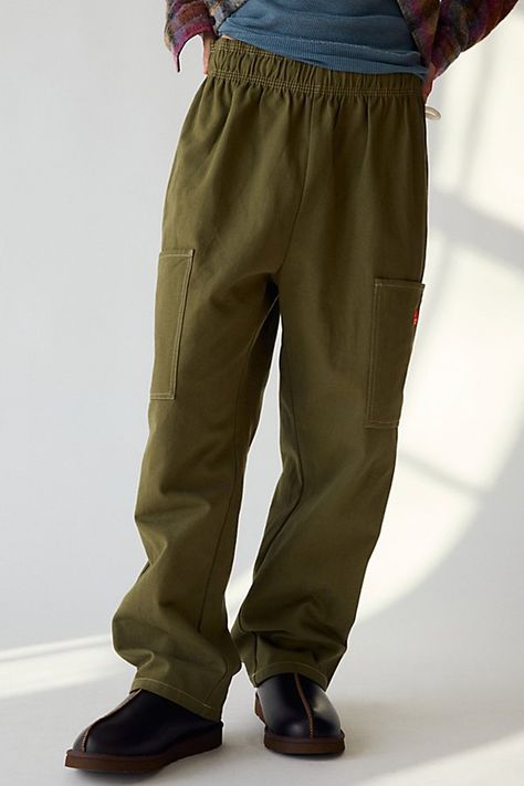 Semi wide chef pants by Cookman in a durable cotton-blend fabric. Elastic waistband pants in a tapered fit with pockets at the front & back. Features Cookman semi wide chef pant Chef pants from Cookman Drawstring closure waist 2 front pockets; 2 back pockets Tonal pattern allover Content + Care 78% Cotton, 21% rayon, 1% polyester Machine wash Imported Size + Fit Model in Dark Green is 6’1" and wearing size Medium Measurements taken from size Medium Rise: 13" Inseam: 28" Leg opening: 9.5" | Cookman Semi Wide Chef Pant in Duck Canvas Olive, Men's at Urban Outfitters Chef Pants, Waistband Pants, Elastic Waistband Pants, Duck Canvas, Dark Green, Urban Outfitters, Fitness Models, Chef, Cotton Blend