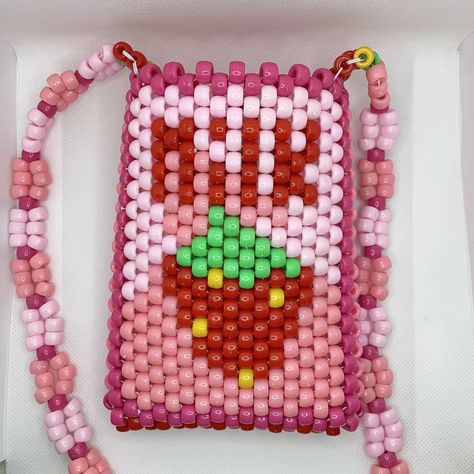 "Strawberry Milk carton crossbody Kandi purse is hand-made 100% from beads on ONE string. Just like you, all of the purses on my shop will always be 1/1.  DIMENSIONS: Bag - 6.5\" tall x 5\" wide  Strap - 48\" long  All items are hand-made on white jewelry string and triple-knotted to ensure the best stretch and durability. As a thank you, every order also includes FREE GIFTS! (Bigger orders = bigger gifts 😊)" Kandi Purse Tutorial, Pony Bead Bag, Kandi Wallet, Kandi Bag Pattern, Kandi Purse, Kandi Bag, Strawberry Milk Carton, Rave Bracelets, Kandi Cuff Patterns