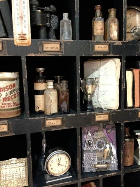 curio display of curiosities Curio Cabinet Displays Antique, Curio Wall Display, Antique Bottle Display Ideas, Wall Of Curiosities, Curiosity Cabinet Aesthetic, Curiosity Cupboard, Bottle Spells, Victorian Curiosities, Curio Cabinet Displays