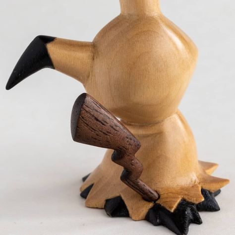 Can never get enough of that walnut and basswood contrast 👌  #woodenpokedex #gottacarveemall . . . . . . #pokemon  #mimikyu #pokemonfigure #pokemonart #pokemongift #geekart #woodcarving #woodart #woodsculpture #handcarved #pokemonswordshield #pokemoncenter #pokemonsword #pokemonshield #pokemoncommunity #woodworking #whittling Pokemon Wood Carving, Wooden Pokemon, Pokemon Mimikyu, Wood Carving Small Figures, Small Wood Carved Animals, Wooden Figurines Carved Wood, Pokemon Toys Sculptures & Statues, Pokemon Gifts, Wood Worker