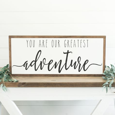 "You Are Our Greatest Adventure ++ ABOUT THIS SIGN ++ SIZE: 13.5\" tall and 31.5\" wide with the frame (Custom sizes available) COLORS SHOWN: White background with black lettering FRAMING: Our signature Espresso stain is used on all of our signs (Custom frame colors available) Our frames have a depth of 1.5\" inches MATERIALS: We use only high quality birch wood for our signs, and finish them with our pine frames.  Each sign is hand-painted and are recommended for indoor use only. QUESTIONS? Ple Our Greatest Adventure Sign, New Adventure Quotes, Our Greatest Adventure, Adventure Signs, Family Wood Signs, Adventure Nursery, Diy Dining Room, Hand Painted Wood Sign, Diy Wood Signs