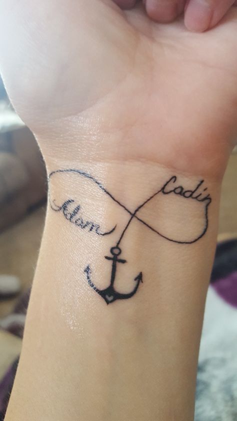 Love my tattoo.. my boys my world.  . Son's are anchors to a mother's life Son Name Tattoo For Mom, Sons Names Tattoo, Anchor Tattoo With Name, Anchor Tattoos With Names, Anchor Tattoos For Women With Names, Husband And Wife Anchor Tattoos, Mother Son Anchor Tattoo, Anchor Name Tattoo, Family Anchor Tattoos