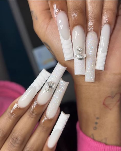 long white acrylic nails with charms and glitter Long White Nails, Tapered Square Nails, White And Silver Nails, Long Acrylic Nail Designs, White Glitter Nails, Colored Acrylic Nails, White Acrylic Nails, Dope Nail Designs, French Acrylic Nails