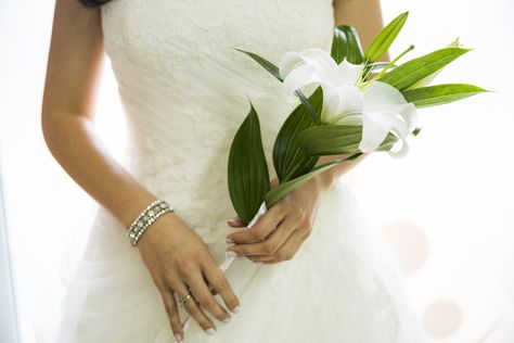 I absolutely love this picture!! Again, I wasn't traditional at all, and I didn't want to walk down the isle with a bouquet. So I got myself a beautiful single white Lily, the flower that I was named after (Flor de Lis)! Photoshoot Female, Lily Bouquet, White Lily, Mini Wedding, White Lilies, Bridesmaid Flowers, The Isle, Wedding Looks, Dream Wedding