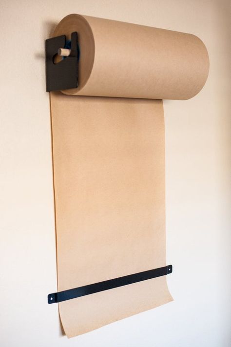 24 Paper Roll holder for the DIY craftsman  Do away with a messy workspace and get that paper roll off your table or floor and onto a rad wall mount! This mount helps organize and make those bulky paper rolls useable. This holder helps to get your workshop, office or shop organized. Utilize the Brown Paper Roll, Paper Roll Dispenser, Drawing Paper Roll, Memo Writing, Industrial Packaging, British Steel, Bar Dimensions, Paper Roll Holders, Wall Mount Bracket