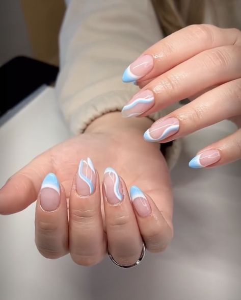 Blue Swirl French nails 🦋 Baby Blue Almond Nails Designs, Acrylic Nails Ideas Almond Shape, Nail Designs Almond Shape Ideas, Athestic Nails, Trending Acrylic Nails Almond, White Nails With Designs Almond, Spring Almond Shaped Nails, White Almond Nails With Design, Birthday Nails Almond Shape