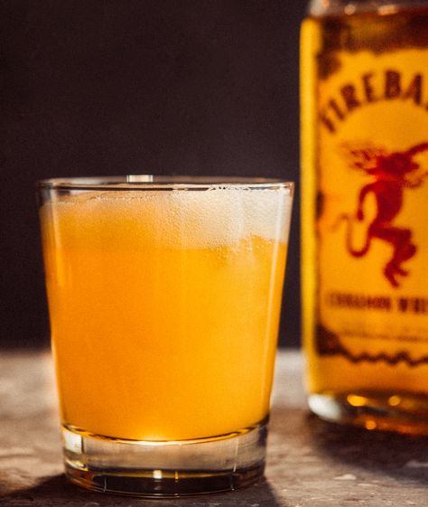 Taste the fiery kick of Fireball in Man-mosa. Find out how to make this red hot mixed drink here. Hot Mixed Drinks, Fireball And Cream Soda, Fireball Mixed Drinks, Fireball Drinks Recipes, Whisky Recipes, Fireball Cocktails, Business Drinks, Drinks To Make At Home, Fireball Recipes