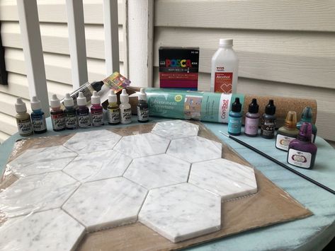 This is a project that I have been wanting to do for quite some time and my major stumbling block was finding the right sized marble hexagon tiles. I looked high and low and low and high and they were not to be found anywhere around me. I also made the bad decision that while I was out looking for these tiles to just walk through Target. I would not have spent $100 dollars in Target if I had not been out looking for these tiles. I ended up finding the correct sized tiles on Amazon and… Hexagon Marble Tile, Coaster Projects, Coasters Diy, How To Make Resin, Diy Concrete Countertops, 100 Dollars, Ink Crafts, Hexagon Coasters, Wood Mosaic