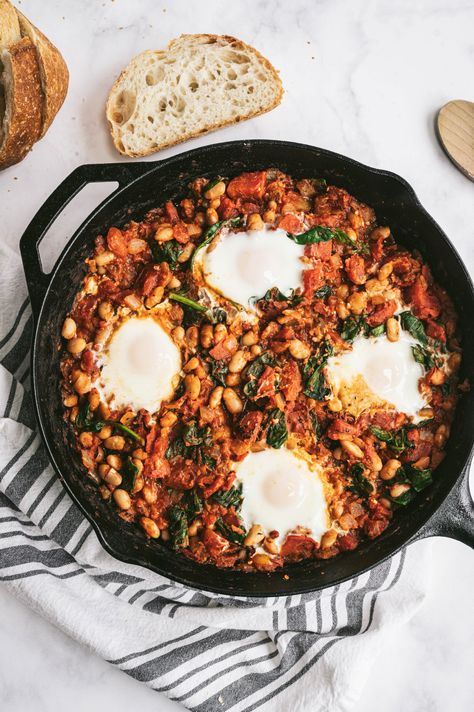 Whip up this one-pan smoky White Bean Shakshuka for a weekend brunch, but it is just as good for breakfast, lunch, and dinner! #brunch #eggs #shakshuka #breakfast #dinner #recipe #easyrecipe White Bean Shakshuka, Eggs Shakshuka, Shakshuka Breakfast, Brunch Eggs, Breakfast Dinner, Fire Roasted Tomatoes, Easy Homemade Recipes, White Bean, Weekend Brunch