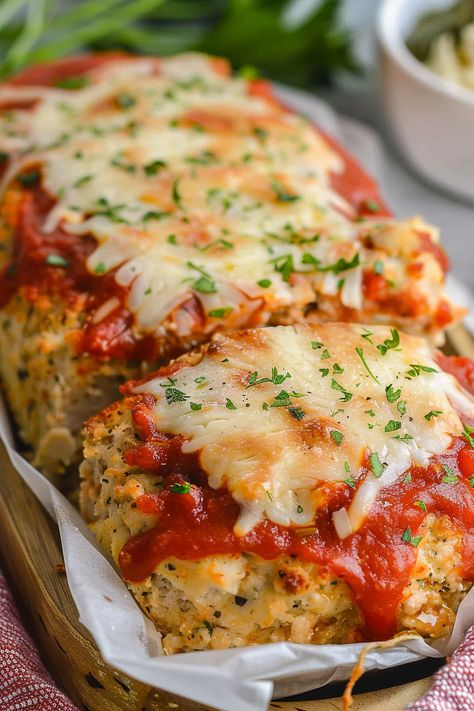 Dive into a mouthwatering twist on classic meatloaf with our Parmesan Chicken Meatloaf recipe! Packed with flavor, it's a family favorite. Try it tonight! Chicken Parmesan Meatloaf Muffins, Keto Beef Recipes For Dinner, No Red Meat Dinner Ideas, Garlic Parm Meatloaf, Garlic Parmesan Chicken Mini Meatloaf, Garlic Parm Chicken Meatloaves, Parmesan Chicken Meatloaf, Chicken Parm Meatloaf, Garlic Parm Chicken Meatloaf