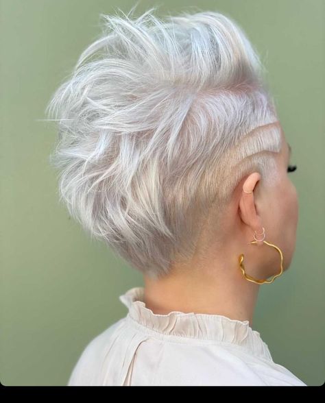 There is something about platinum hair that just looks stunning. Going this light can be a little intense but once you make the switch, you'll love th... Short Platinum Hairstyles, Platinum Undercut, Short Edgy Hair, Platinum Blonde Short Hair, Platinum Blonde Pixie Cut, White Short Hair, Platinum Blonde Hair Color Ideas, Platinum Pixie Cut, Short Platinum Blonde Hair