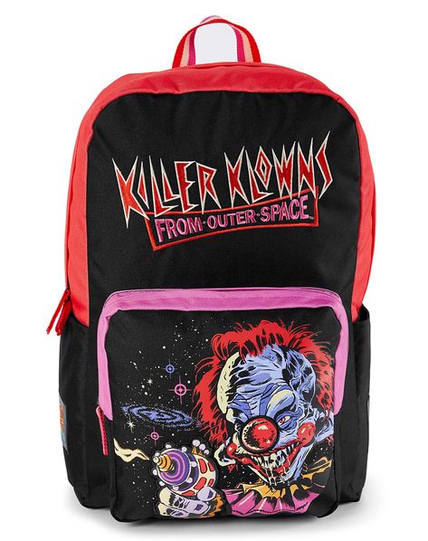 Add a fun twist to your school gear with this Killer Klowns from Outer Space Backpack with artwork by Steven Rhodes! This bold backpack is sure to get everyone's attention, while giving you plenty of room for all your daily essentials. Stash your laptop, books, and supplies easily for day and night in this convenient backpack. Officially licensed Exclusively at Spencer's Adjustable padded straps Padded back Strap length: 19.7" Three pockets One large pocket One front pocket One side pocket Zippe Spencer Store, Space Backpack, Killer Klowns From Outer Space, Steven Rhodes, Horror Gifts, Spencers Gifts, Pretty Princess, School Bags For Kids, Cute Bags