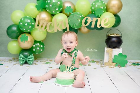 Add the perfect amount of sparkle to your Lucky One's event with this beautiful glitter banner from Tickled Glitzy Boutique! Banner is made on thick, premium glitter cardstock. Letters are done in glitter gold with a green glitter shamrock accent. Banner is hung on pretty gold twine that nicely blends into the background making the banner the star of the show.  Letters range from 4 to 6 inches in height, all lowercase. If you would like a different font or size, we can easily make that change. W Lucky One Party, Lucky One Cake, Boutique Banner, Lucky One Birthday, St Patrick's Day Birthday, Irish Party, One Cake Topper, One Banner, One Year Birthday