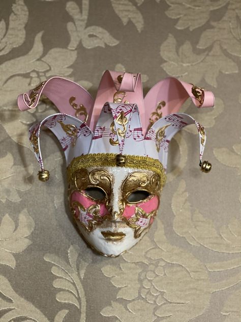 Original Venetian make mask made entirely by hand and decorated by hand in acrylic colors, gold leaf. Decorative only mask All our masks are handmade by our staff (me, my wife and our collaborators) in our atelier in Venice. The masks are all made of paperweight and are made using ancient techniques from the 1300s They are decorated with acrylic colors, gold leaf, silver leaf, trifies, lace and Swarovski crystals so as to make them more valuable. We are a small family business and have been labo Clown Masquerade Mask, Venetian Masks Women, Diy Venetian Mask, Porcelain Doll Face Mask, Venetian Jester Mask, Venetian Masquerade Mask, Costume Mask Ideas, Creative Mask Ideas, Plaster Mask Ideas