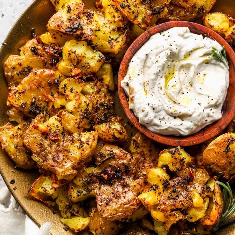 Rosemary-Sumac Smashed Potatoes with Roasted Garlic Dip Arugula Goat Cheese Salad, Roasted Garlic Dip, Dishing Out Health, Crispy Roasted Potatoes, Vegetarian Bbq, Rosemary Potatoes, Garlic Dip, Healthy Probiotics, Crowd Pleasing Recipes