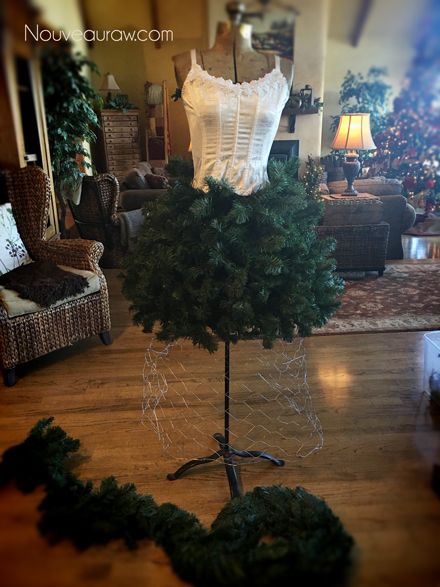 adding a corset to the antique dress form Christmas Mannequin Display, Dress Christmas Tree Diy, How To Make A Mannequin Christmas Tree, Christmas Tree Dress Mannequin Diy Tutorial, Manniquine Christmas Tree Dresses, Diva Christmas Tree, Dress Form Christmas Tree Diy, Christmas Mannequin Tree, Maniquin Christmas Tree Ideas