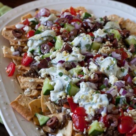 Greek Nachos Greek Nachos, Greek Fries, Greek Grilled Chicken, Greek Spices, Cucumber Onion, Garlic Roasted Potatoes, Homemade Tzatziki, Greek Olives, Grilled Onions