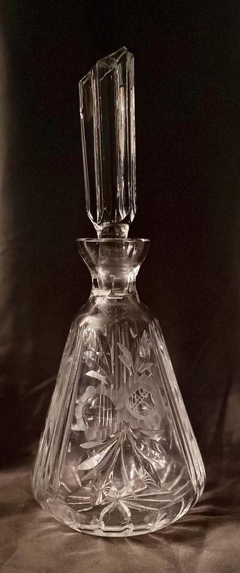 Introducing a vintage etched glass wine decanter that promises to add a unique touch to your collection. This decanter is perfect for anyone who loves to entertain, and features a clear glass body with intricate etchings. The decanter stands at 12 inches tall and comes with an original lid/stopper that is unlike any other. Unfortunately there are some small chips to the stopper, please see photos before purchasing. Made of high-quality glass material, this vintage decanter is a must-have for col Victorian Glassware, Vintage Decanter, Wine Enthusiast, Etched Glass, Decanters, Glass Etching, Wine Decanter, Glass Material, Etching