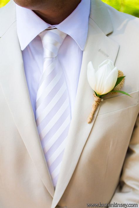 white tulip boutonniere designed by Bella Flora 30a. Tulip Boutonniere Wedding, White Tulip Boutonniere Wedding, White Tulip Boutonniere, White Wedding Tuxedo With Button Details, Tulip Boutonniere, White Lisianthus Boutonniere, Groom Flower Pin White, White Wedding Suit, White Boutonniere